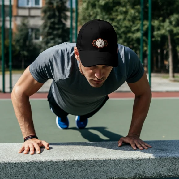 Certified Menace Black Hat Athletic Scene Man doing push ups wearing Certified Menace black cap outdoors