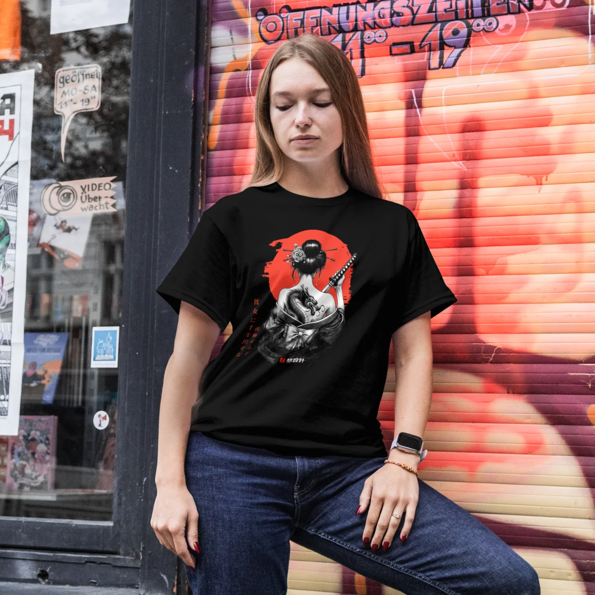 Model wearing a black Onna-Bugeisha graphic T-shirt outdoors.