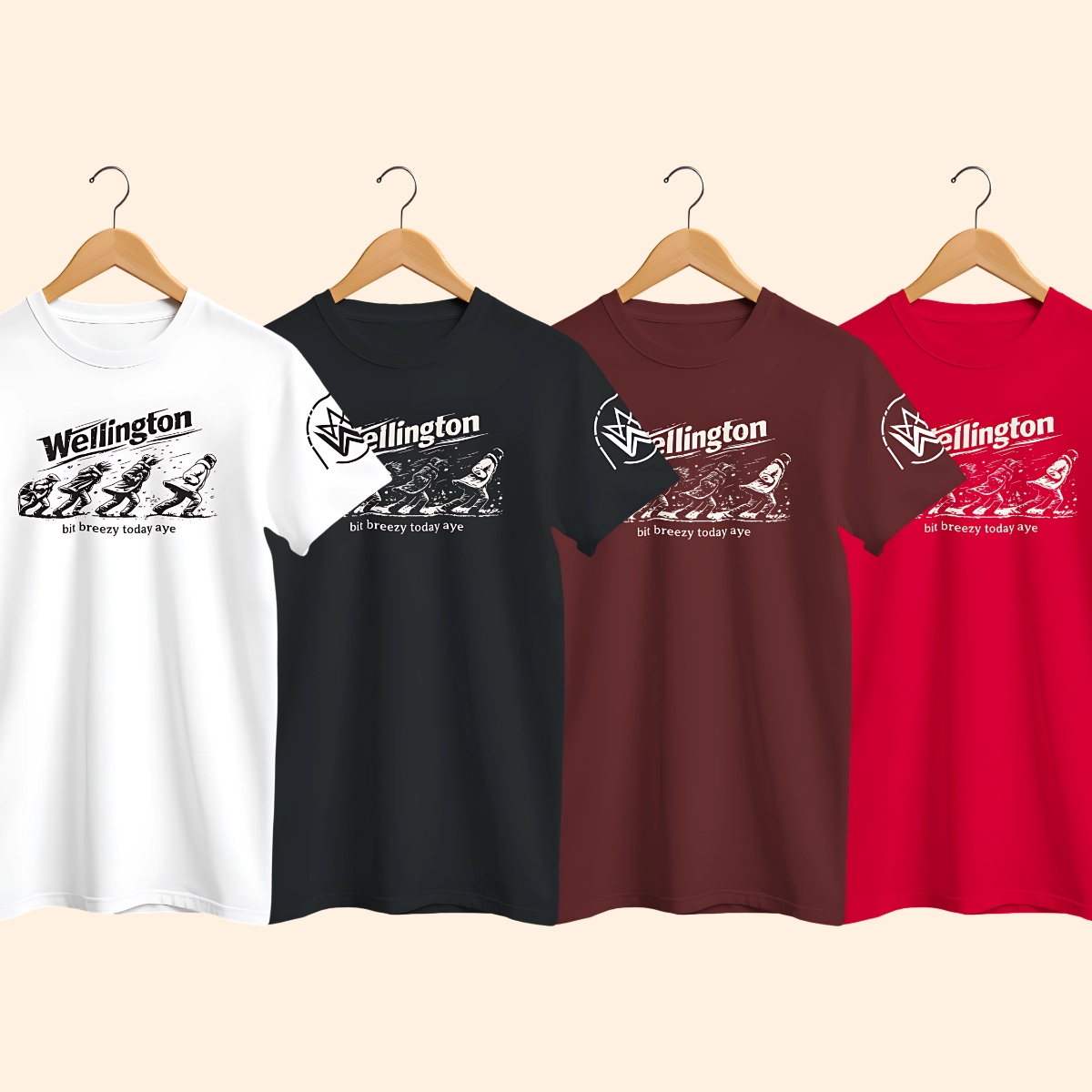 Four Wellington Breezy T-shirts in white, black, maroon and red shown on hangers with the front graphic partly visible.