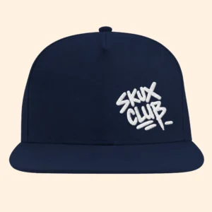 Front view of a navy flat bill cap with white SKUX CLUB graffiti handstyle embroidery on the off-centre front panel.