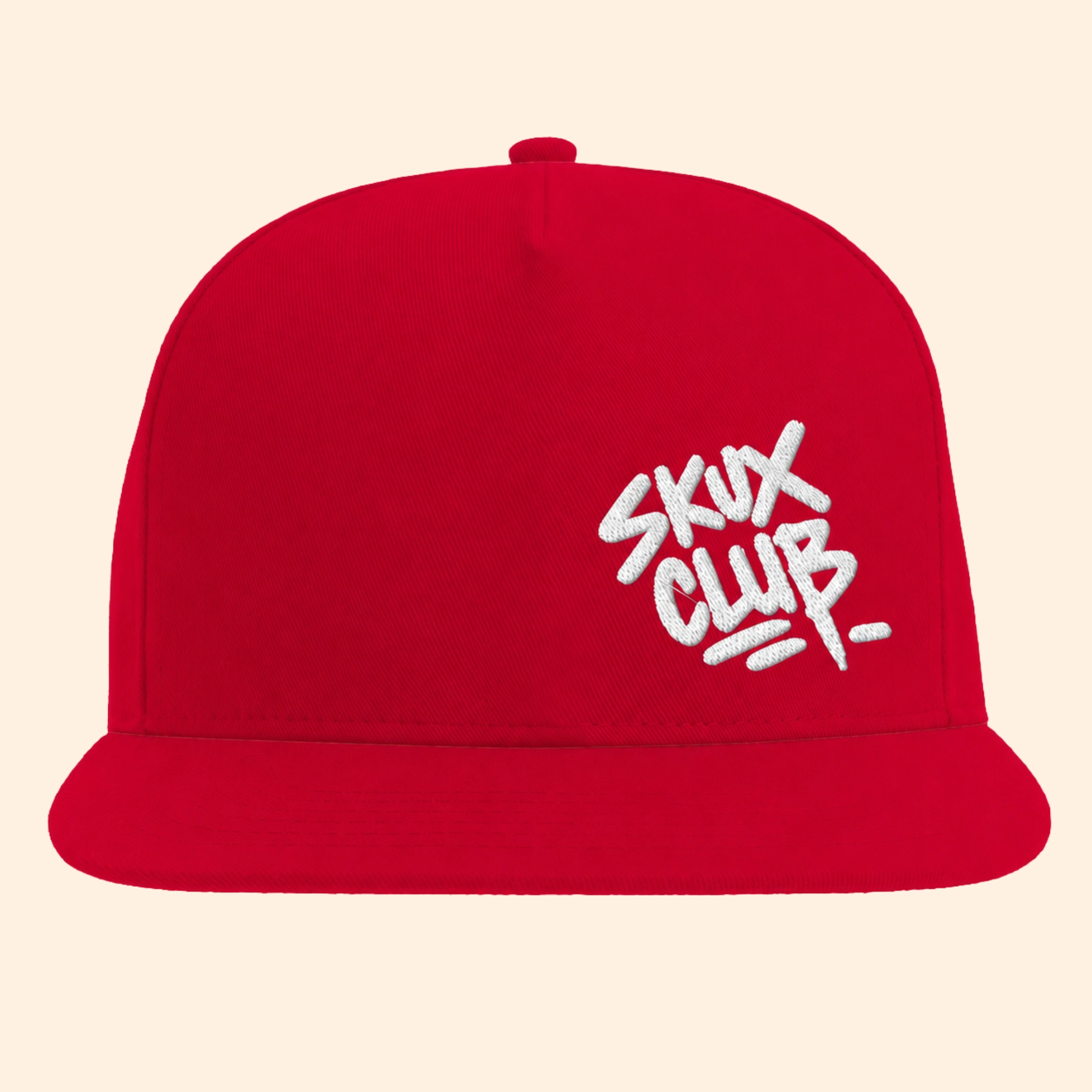 Front view of a red flat bill cap with white SKUX CLUB graffiti handstyle embroidery positioned off-centre on the front crown.