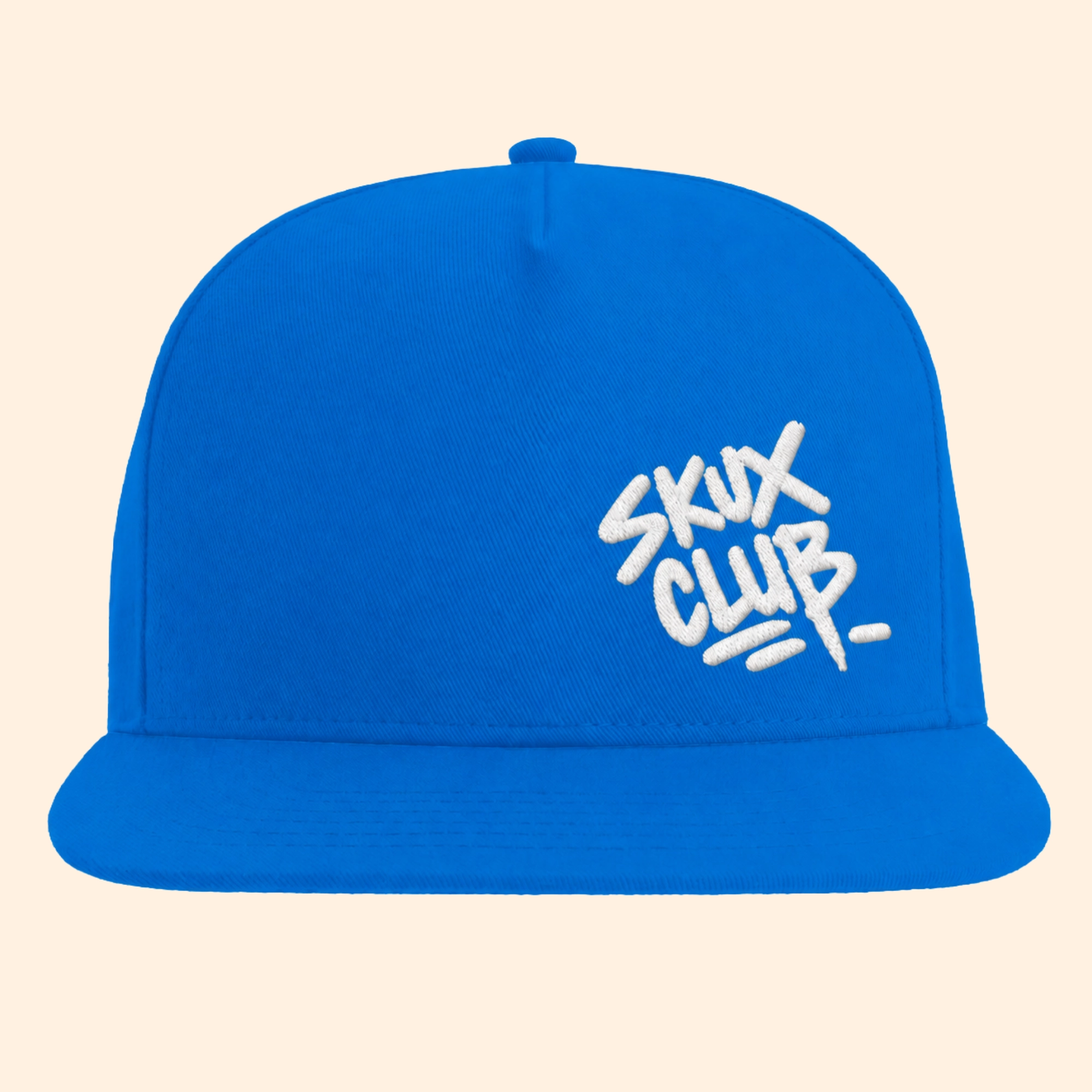Front view of a royal blue flat bill cap with white SKUX CLUB graffiti handstyle embroidery on the off-centre front panel.